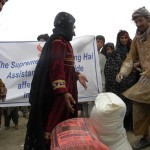 A woman who has lost her husband in the landslide, receiving Supreme Master Ching Hai’s relief aid