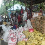 Local people helping with packing relief items for distribution
