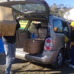 Volunteers help unload the sleeping bags at Camp Moria. November 30, 2015