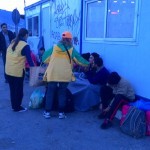 Sharing chocolates to cheer up the refugees waiting for a ferry at the port - December 1, 2015