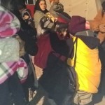 Distributing hats, gloves, socks and chocolate to refugees in Idomeni, Greece - December 9, 2015