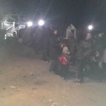 Refugees in Idomeni, Greece waiting at night to cross the border with Macedonia - December 9, 2015