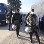 Police officers helping to provide security at the refugee camp in Idomeni, Greece - December 4, 2015