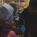 Interviewing child volunteer helping the refugees in Kavalas, Greece, - December 9, 2015