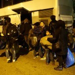 Refugees boarding buses in Kavalas, Greece - December 9, 2015