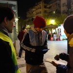 20151212 asking the info about refugees from local translator at Victory Park in Athens Greece