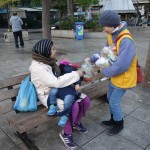 20151214 around 8AM refugees are blissful happy to receive our foods and flyer at Victory Park in Athens Greece (1)