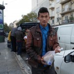 20151214 around 8AM refugees are blissful happy to receive our foods and flyer at Victory Park in Athens Greece (27)