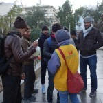 20151214 around 8AM refugees are blissful happy to receive our foods and flyer at Victory Park in Athens Greece (4)