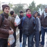 20151214 around 8AM refugees are blissful happy to receive our foods and flyer at Victory Park in Athens Greece (5)