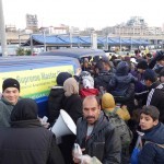 20151215 around 8AM refugees are blissful happy to receive our foods and flyer at Pireaus harbor in Athens Greece (11)