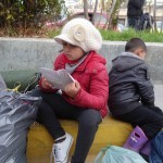 20151215 around 8AM refugees are blissful happy to receive our foods and flyer at Pireaus harbor in Athens Greece (41)