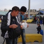 20151215 around 8AM refugees are blissful happy to receive our foods and flyer at Pireaus harbor in Athens Greece (48)