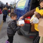 20151215 around 8AM refugees are blissful happy to receive our foods and flyer at Pireaus harbor in Athens Greece (57)