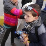 20151215 around 8AM refugees are blissful happy to receive our foods and flyer at Pireaus harbor in Athens Greece (63)
