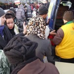20151215 around 8AM refugees are blissful happy to receive our foods and flyer at Pireaus harbor in Athens Greece (65)