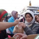 20151215 around 8AM refugees are blissful happy to receive our foods and flyer at Pireaus harbor in Athens Greece (71)