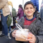 20151215 around 8AM refugees are blissful happy to receive our foods and flyer at Pireaus harbor in Athens Greece (76)