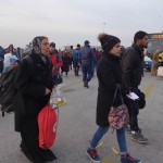 20151215 around 8AM refugees are blissful happy to receive our foods and flyer at Pireaus harbor in Athens Greece (81)