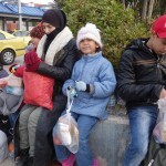 20151215 around 8AM refugees are blissful happy to receive our foods and flyer at Pireaus harbor in Athens Greece (83)