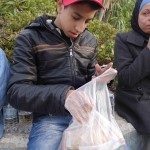 20151215 around 8AM refugees are blissful happy to receive our foods and flyer at Pireaus harbor in Athens Greece (84)
