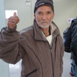 20151215 around 8AM refugees are blissful happy to receive our foods and flyer at Pireaus harbor in Athens Greece (94)