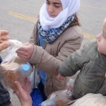 20151215 around 8AM refugees are blissful happy to receive our foods and flyer at Pireaus harbor in Athens Greece (98)