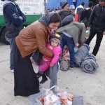 20151217 around 10AM refugees are blissful happy to receive our foods and flyers at Pireaus harbor in Athens Greece (105)
