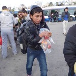 20151217 around 10AM refugees are blissful happy to receive our foods and flyers at Pireaus harbor in Athens Greece (108)