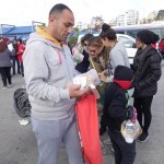 20151217 around 10AM refugees are blissful happy to receive our foods and flyers at Pireaus harbor in Athens Greece (109)