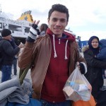 20151217 around 10AM refugees are blissful happy to receive our foods and flyers at Pireaus harbor in Athens Greece (122)