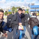 20151217 around 10AM refugees are blissful happy to receive our foods and flyers at Pireaus harbor in Athens Greece (13)