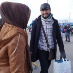 20151217 around 10AM refugees are blissful happy to receive our foods and flyers at Pireaus harbor in Athens Greece (134)
