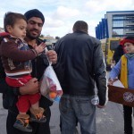 20151217 around 10AM refugees are blissful happy to receive our foods and flyers at Pireaus harbor in Athens Greece (147)