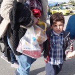 20151217 around 10AM refugees are blissful happy to receive our foods and flyers at Pireaus harbor in Athens Greece (15)