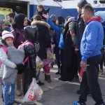 20151217 around 10AM refugees are blissful happy to receive our foods and flyers at Pireaus harbor in Athens Greece (152)
