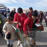 20151217 around 10AM refugees are blissful happy to receive our foods and flyers at Pireaus harbor in Athens Greece (21)