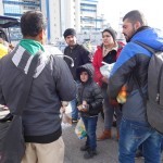 20151217 around 10AM refugees are blissful happy to receive our foods and flyers at Pireaus harbor in Athens Greece (30)