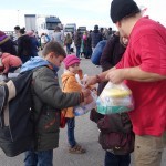 20151217 around 10AM refugees are blissful happy to receive our foods and flyers at Pireaus harbor in Athens Greece (34)
