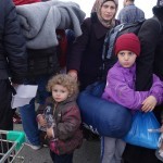20151217 around 10AM refugees are blissful happy to receive our foods and flyers at Pireaus harbor in Athens Greece (38)