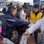 20151217 around 10AM refugees are blissful happy to receive our foods and flyers at Pireaus harbor in Athens Greece (44)