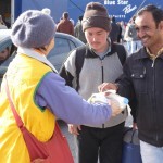 20151217 around 10AM refugees are blissful happy to receive our foods and flyers at Pireaus harbor in Athens Greece (5)