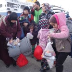 20151217 around 10AM refugees are blissful happy to receive our foods and flyers at Pireaus harbor in Athens Greece (50)