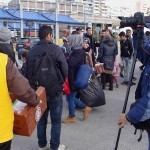 20151217 around 10AM refugees are blissful happy to receive our foods and flyers at Pireaus harbor in Athens Greece (63)