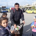 20151217 around 10AM refugees are blissful happy to receive our foods and flyers at Pireaus harbor in Athens Greece (69)