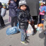 20151217 around 10AM refugees are blissful happy to receive our foods and flyers at Pireaus harbor in Athens Greece (75)