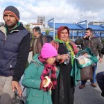20151217 around 10AM refugees are blissful happy to receive our foods and flyers at Pireaus harbor in Athens Greece (76)