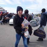 20151217 around 10AM refugees are blissful happy to receive our foods and flyers at Pireaus harbor in Athens Greece (77)