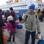 20151217 around 10AM refugees are blissful happy to receive our foods and flyers at Pireaus harbor in Athens Greece (78)