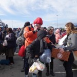 20151217 around 10AM refugees are blissful happy to receive our foods and flyers at Pireaus harbor in Athens Greece (81)